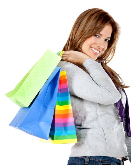 happy woman smiling with shopping bags isolated over a white background
