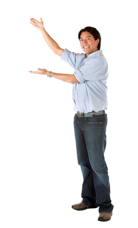 Casual man showing something imaginary - isolated over a white background