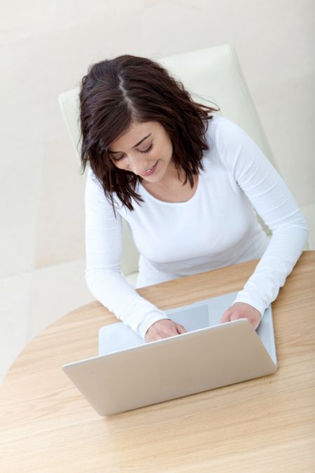 Casual girl on a laptop working at home