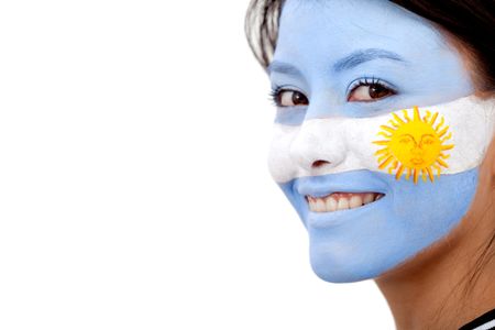 Portrait of a woman with the argentinian flag painted on her face isolated over white