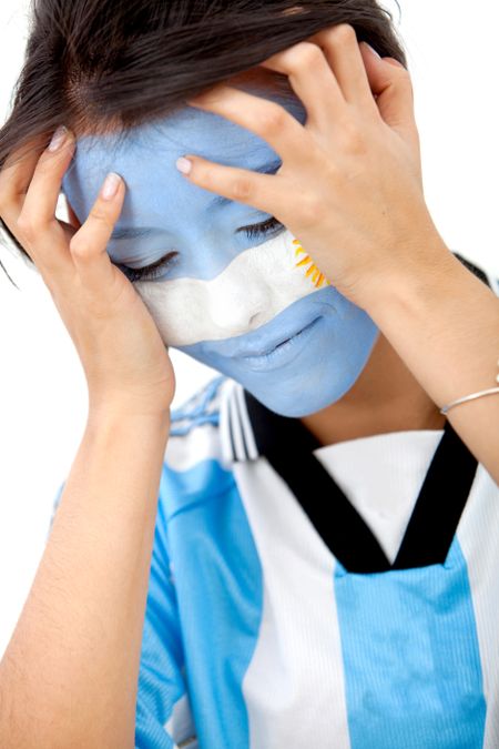 Portrait of a woman with the argentinian flag painted on her face isolated over white