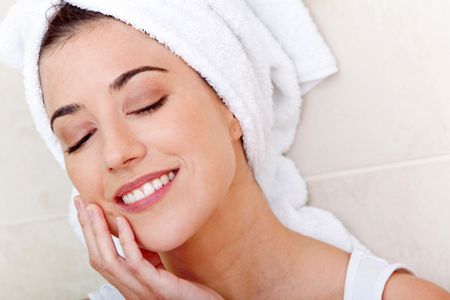 Beauty female portrait with a towel on her head