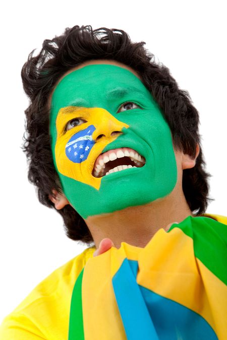 Portrait of a man with the brazilian flag painted on his face isolated over white
