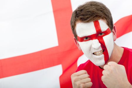 Portrait of a man supporting his team with the english flag painted on his face