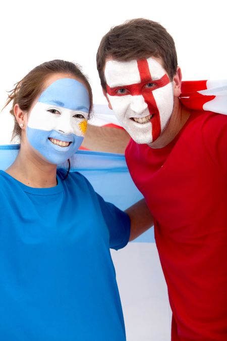 Couple of football fans looking happy with their faces painted - Isolated over white
