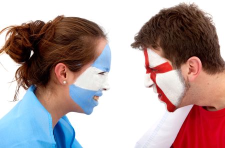 Couple of football fans with their faces painted isolated over white - Argentina versus England