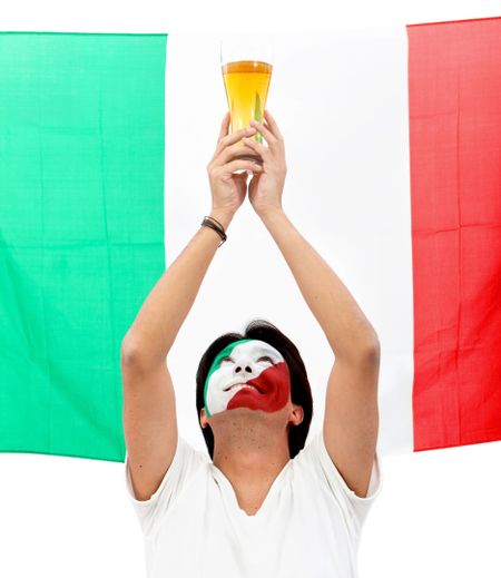 Portrait of a man celebrationg with the italian flag painted on his face isolated over white