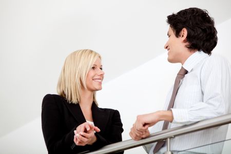 Business couple working at the office and smiling