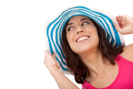 Beautiful summer woman smiling and wearing a hat isolated over white