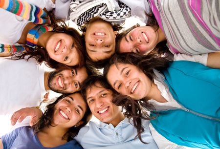 group of happy friends smiling with heads together