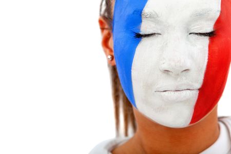 Portrait of a woman with eyes closed and the french flag painted on her face