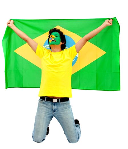 Portrait of a happy man with the brazilian flag painted on his face isolated over white