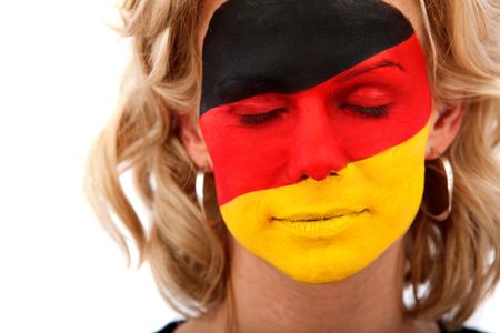 Portrait of a woman with the german flag painted on her face isolated over white