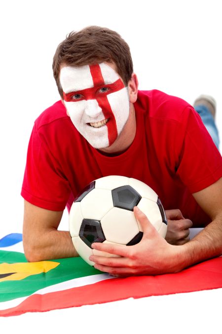Portrait of a man lying on the floor with the english flag painted on his face