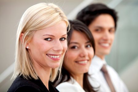 group of business people smiling in an office