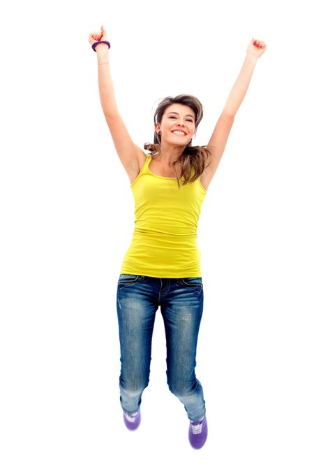 Excited young woman jumping isolated over a white background