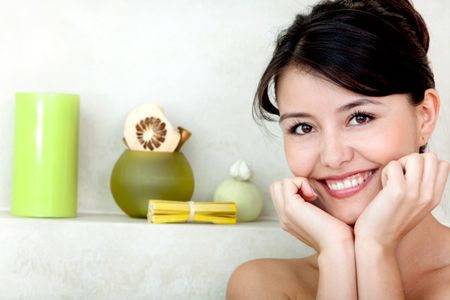 Beauty portrait of a female smiling in the bathroom