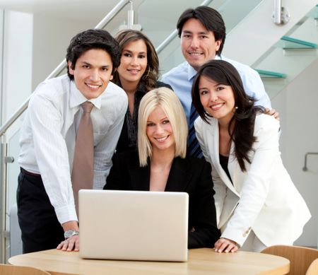 Business group working with a laptop at the office