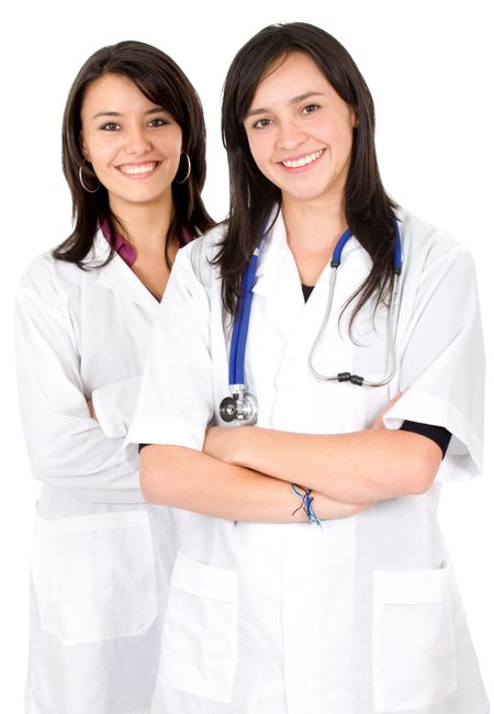 beautiful female doctors smiling over a white background