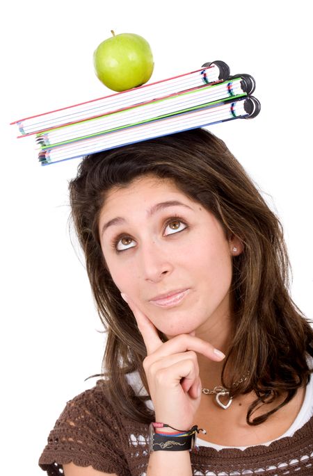 female university student looking very pensive with books and an apple on her head