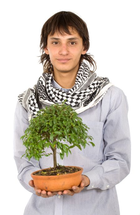 male ecologist holding a tree in his hands over a white background
