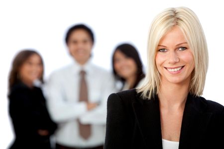 Business woman smiling with her team behind her - isolated over white