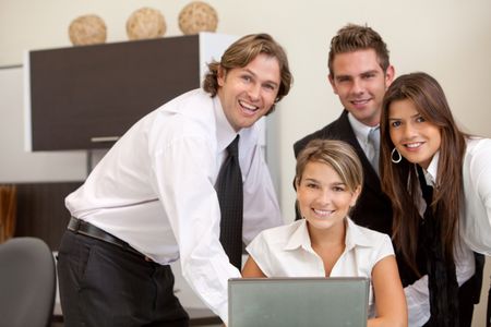 Group of business people on a laptop in an office