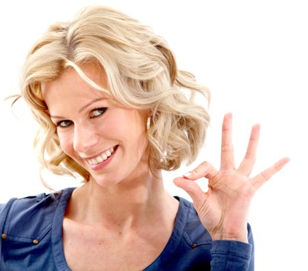 Woman making an ok sign isolated over a white background