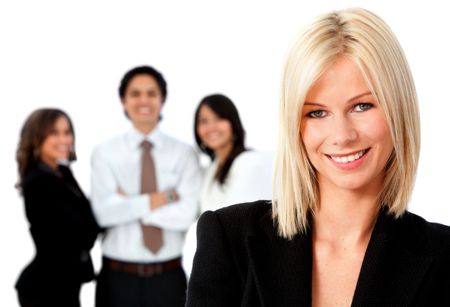 Beautiful business woman smiling with a group behind her isolated over a white background