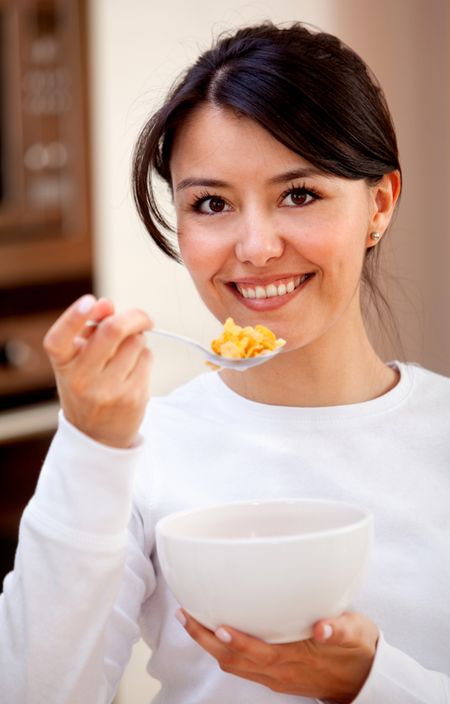 Healthy eating woman having cereals for breaksfast