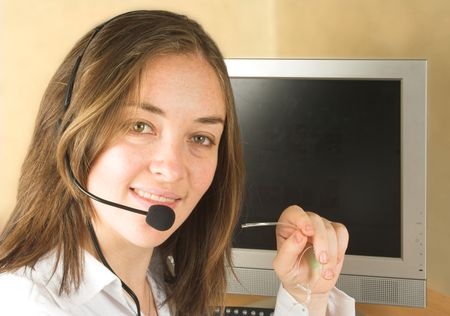 business woman smiling. Customer service center with screen. Good for you to write or place an image on the screen.