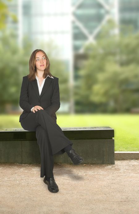 business woman sitting down in a corporate environment