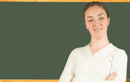 beautiful teacher in front of a black board