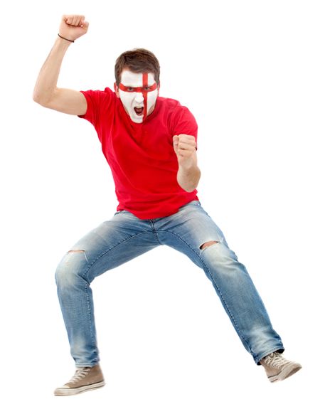 Excited english man with the flag painted on his face jumping