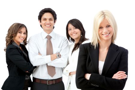 Business woman smiling with a group behind her - isolated over white