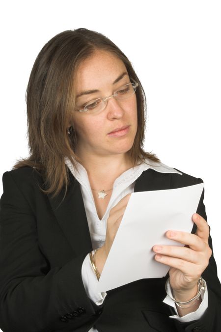 business woman wearing glasses taking notes at a meeting