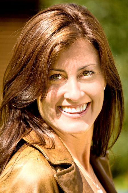 Casual woman portrait smiling outdoors on a sunny day