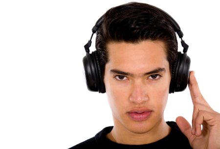 guy listening to music with big headphones isolated over a white background