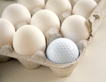 Golf ball in egg carton