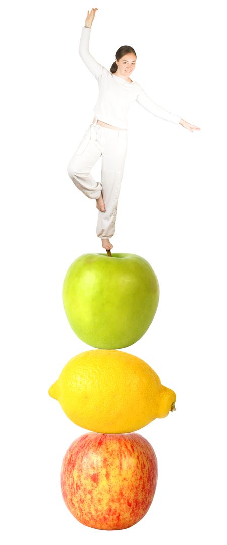 Casual girl balancing on fruits