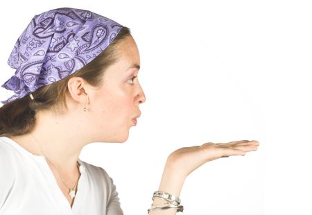 casual woman blowing something on her hand