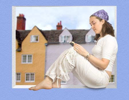 girl wearing headscarf reading on a window sill