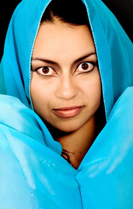 girl in a blue costume over a black background