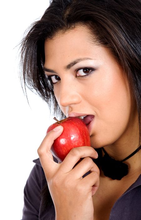 african girl biting an apple over a white background