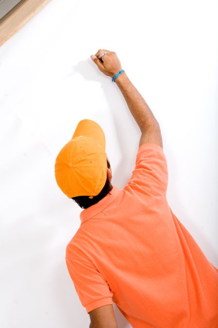 college student writing on a blackboard over a white background