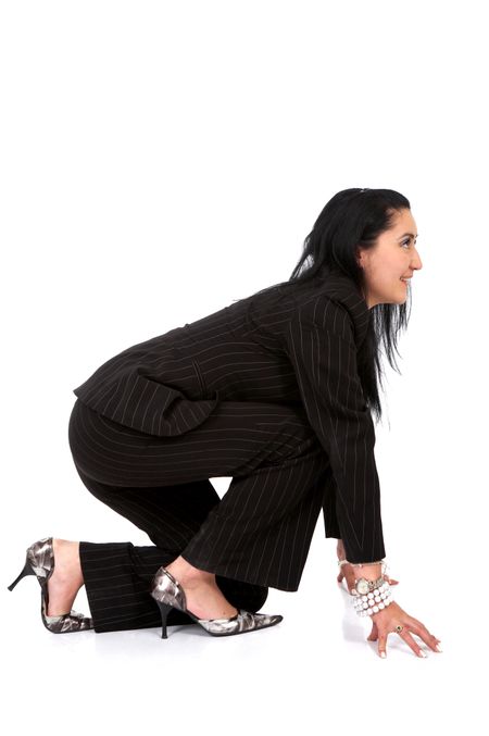 Business woman ready to race - isolated over a white background