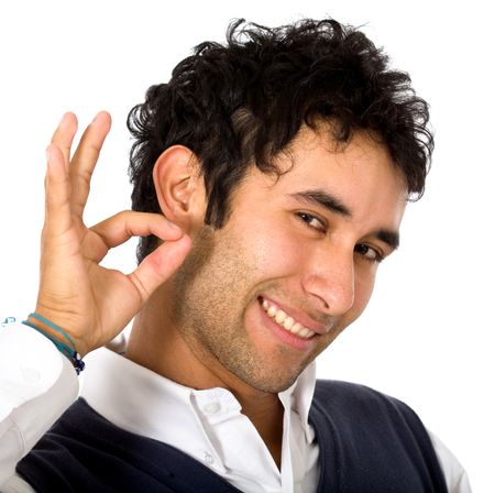 casual man smiling doing the okay sign over a white background