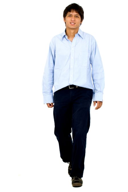 Casual friendly man walking towards the camera – isolated over a white background