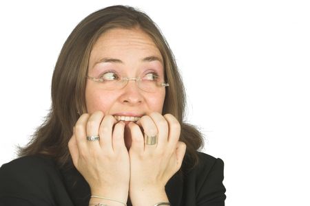 business woman biting her nails due to nerves