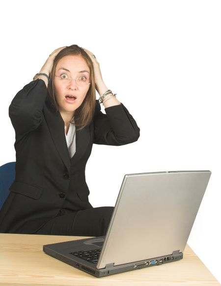 shocked business woman whilst working on her pc